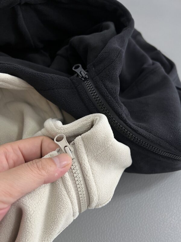 IMG_20261030_14804 Ruibang Apparel oatmeal and black cropped fleece hoodie zipper detail comparison